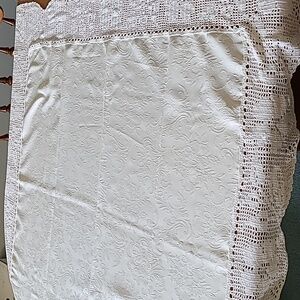 White table covering  with floral design